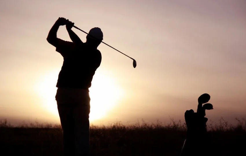 silhouette of golfer