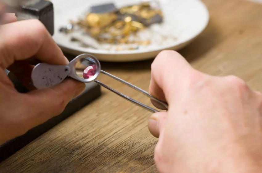 jeweler inspecting ruby