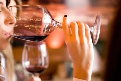 woman tasting wine