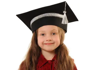 a preschooler in a graduation cap