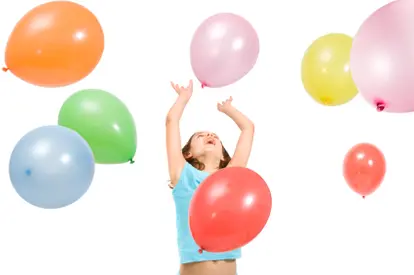 girl playing with balloons