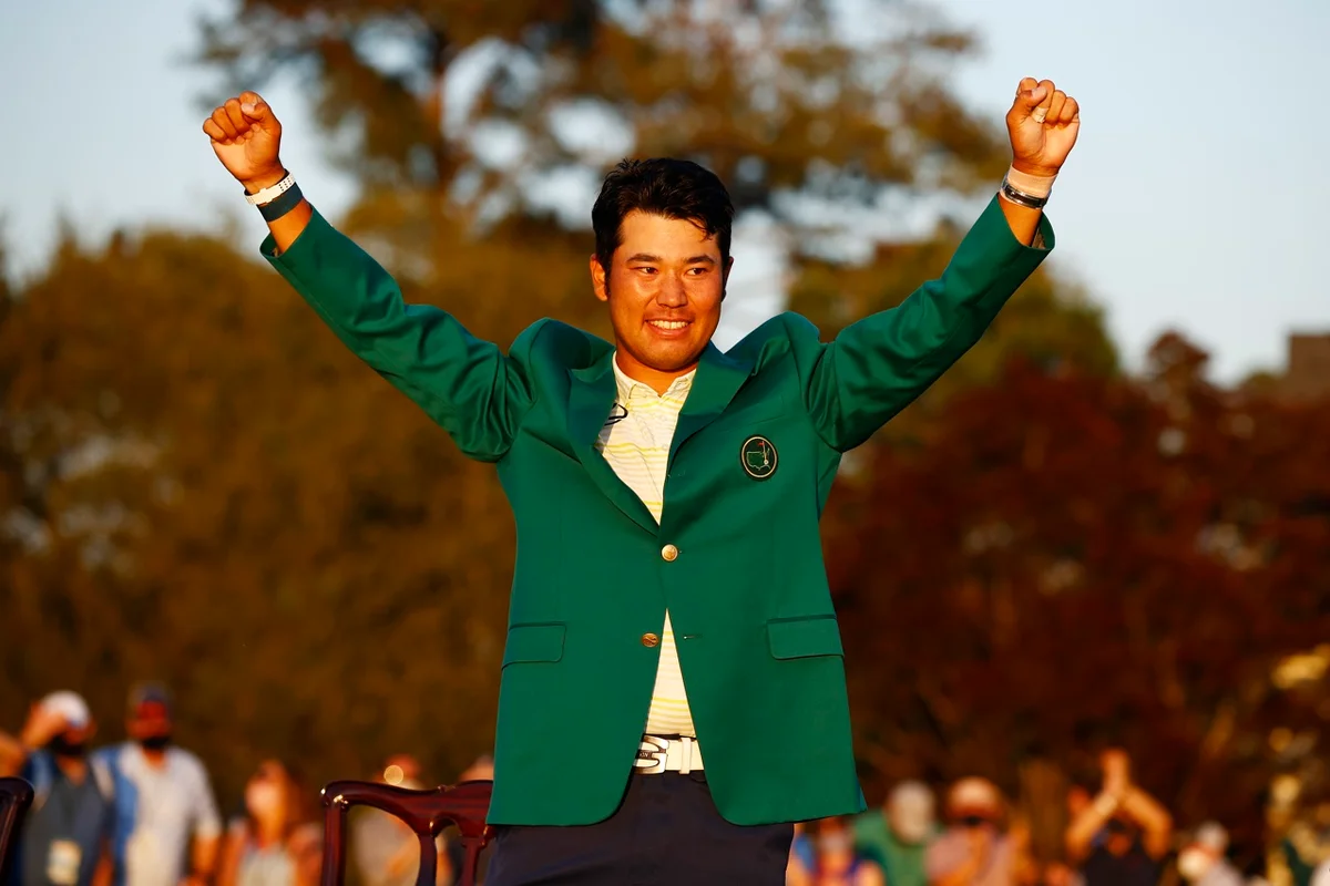 Hideki Matsuyama poses in the green jacket