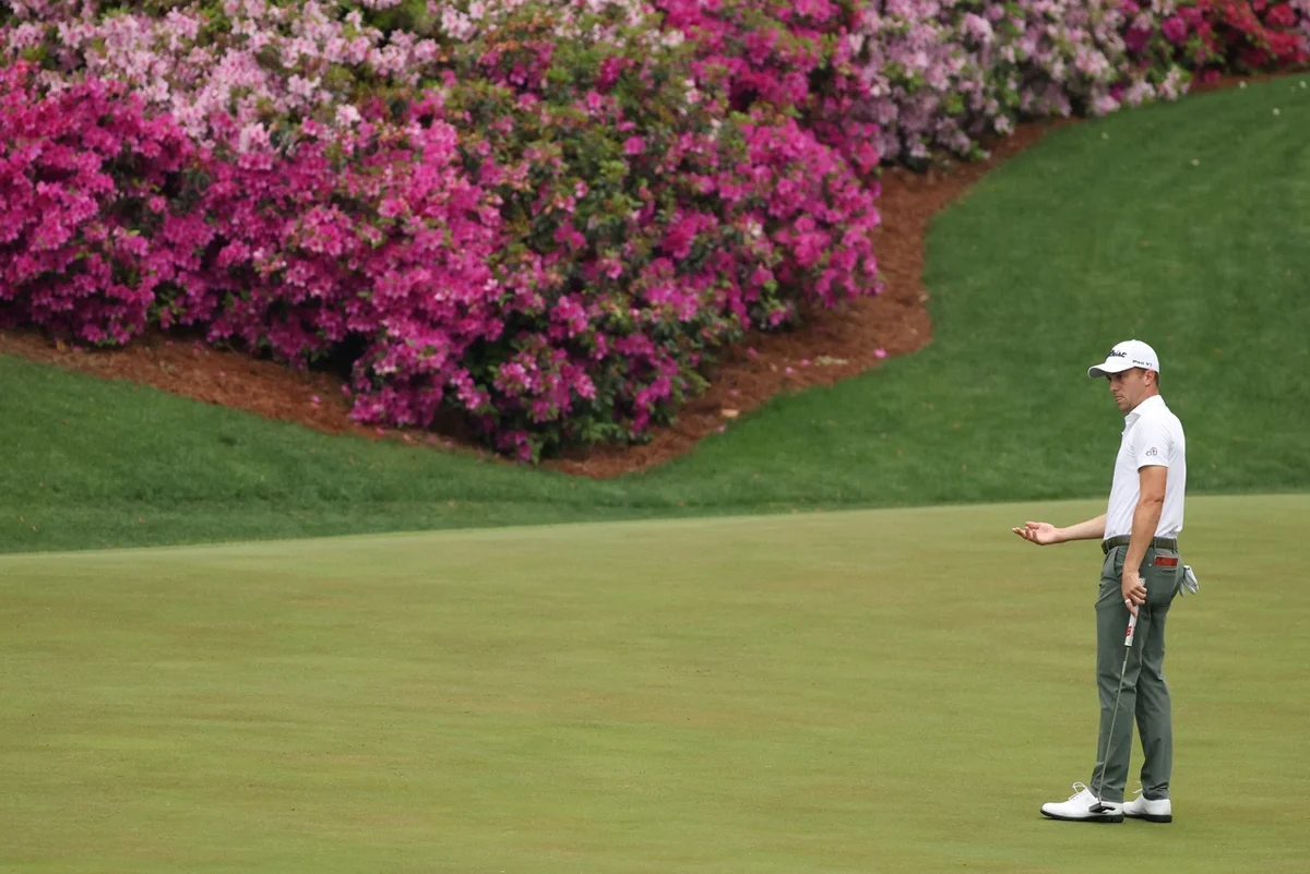 Justin Thomas putts on Augusta's 12th hole