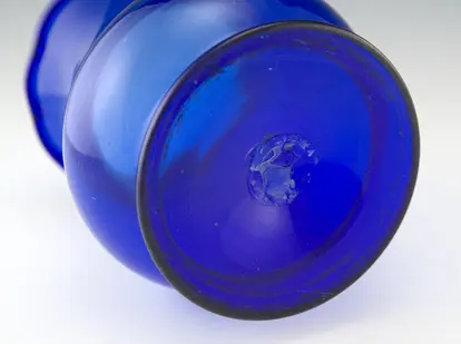 Pontil mark on an antique blown glass vase. Photo courtesy Retro Art Glass, retroartglass.com