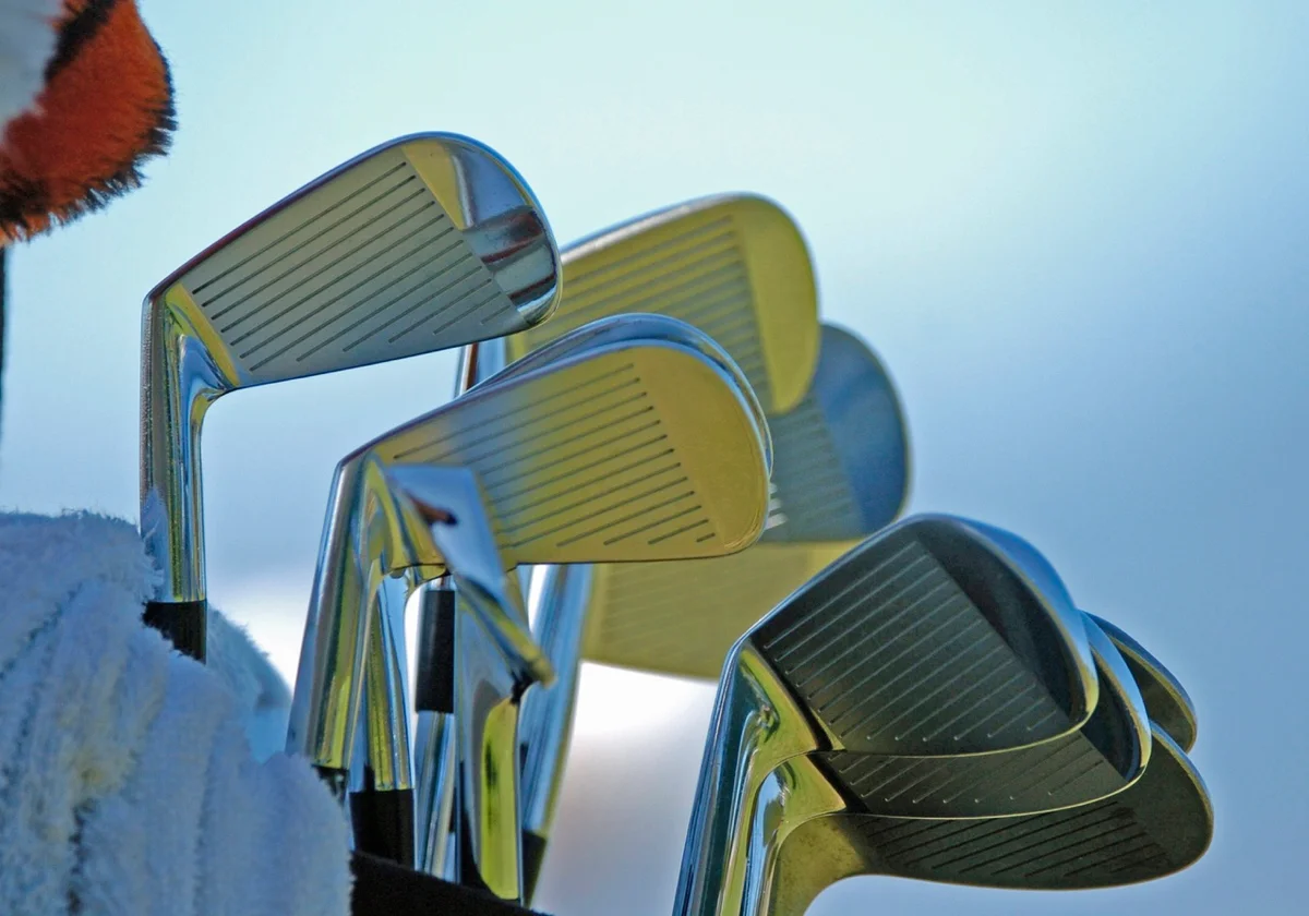 A set of irons in a golf bag