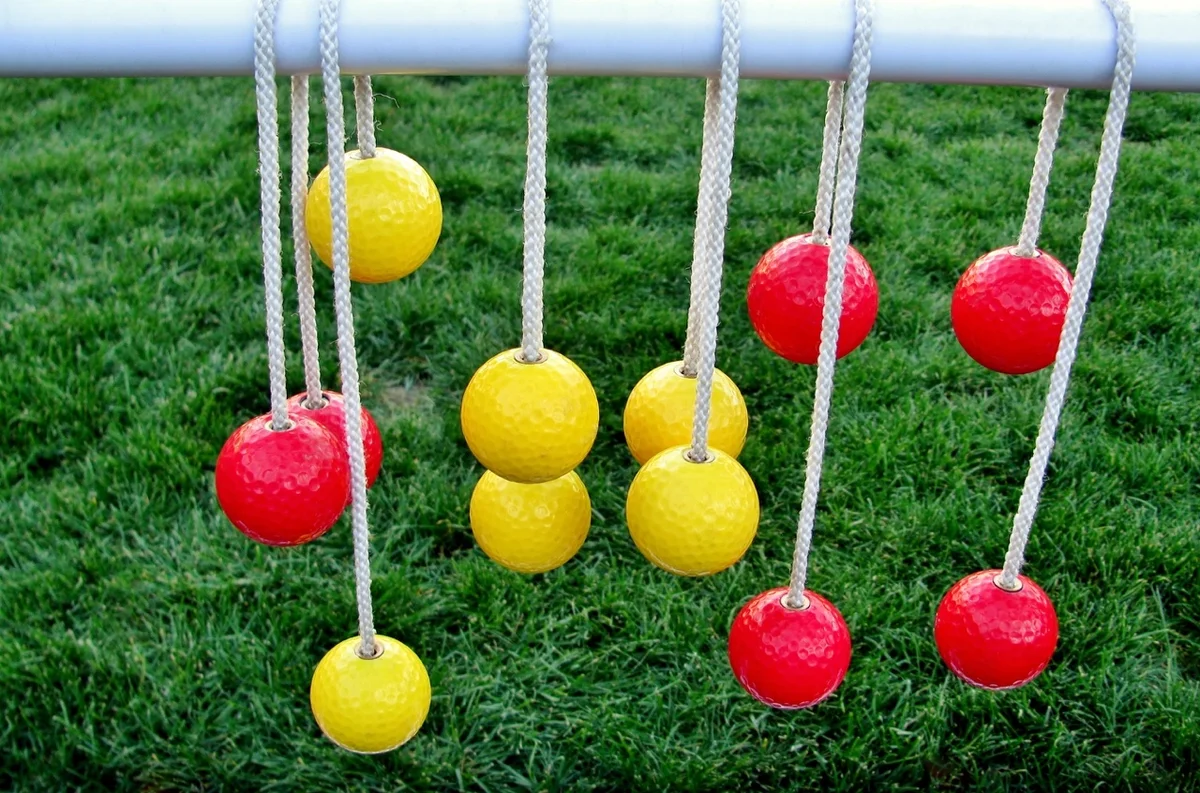 Bolas hang on a ladder golf rung