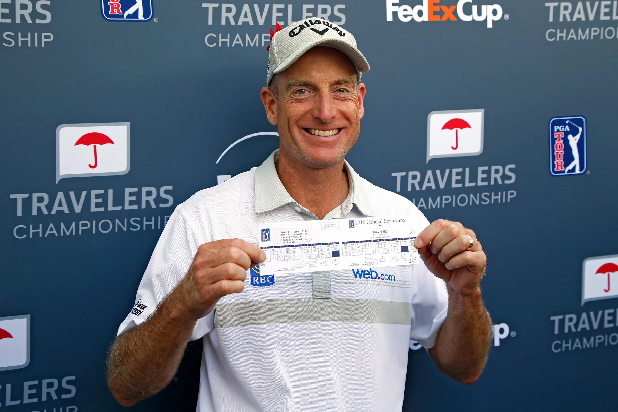 Furyk shows his scorecard after shooting 58