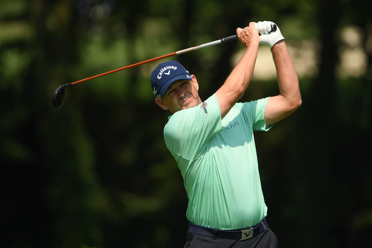 Lee Janzen watching his golf shot