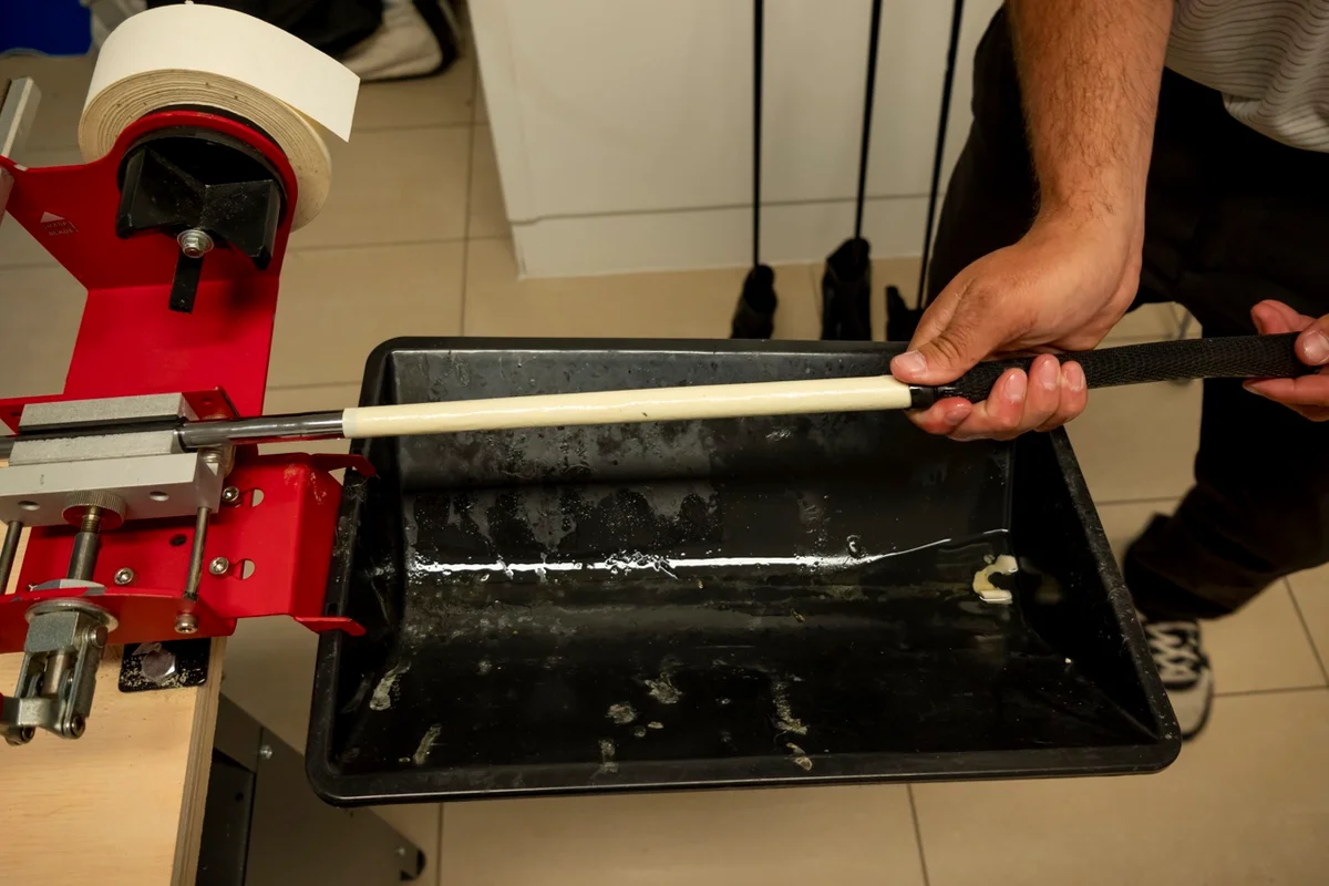 golfer installs new grip to club