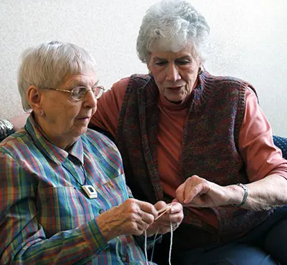 Senior learning to knit.