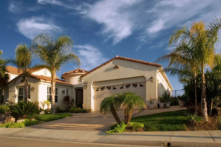 Stucco House with Palm Trees