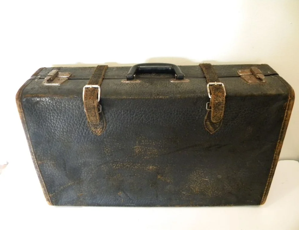 Vintage 1930s Black Leather Suitcase Luggage
Photo by First Rate Antiques & Collectibles on Rubylane.com
http://www.rubylane.com/item/592422-11662/Vintage-1930x27s-Black-