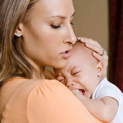 Mother comforting her crying baby