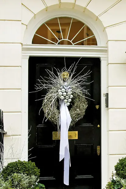 Silver wreath on door