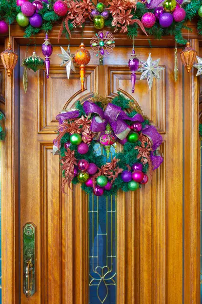 Bright Christmas ornaments on door