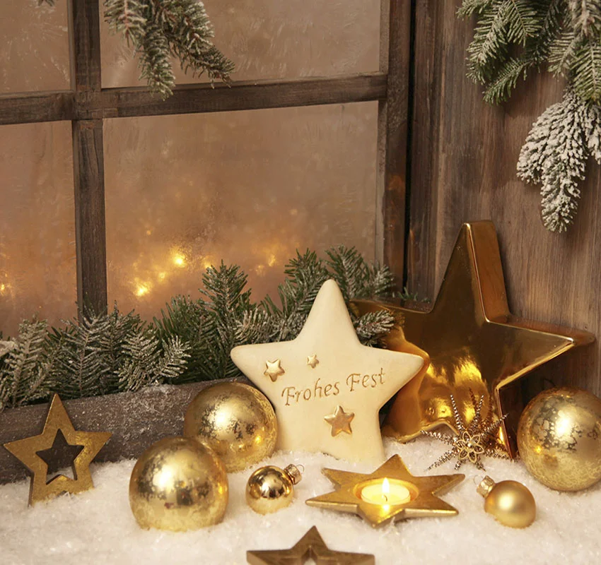 Gold Christmas ornaments on window sill