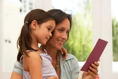 Mother and daughter viewing card