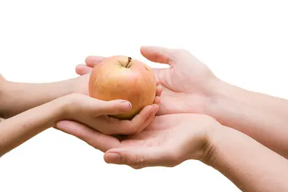 child passing apple