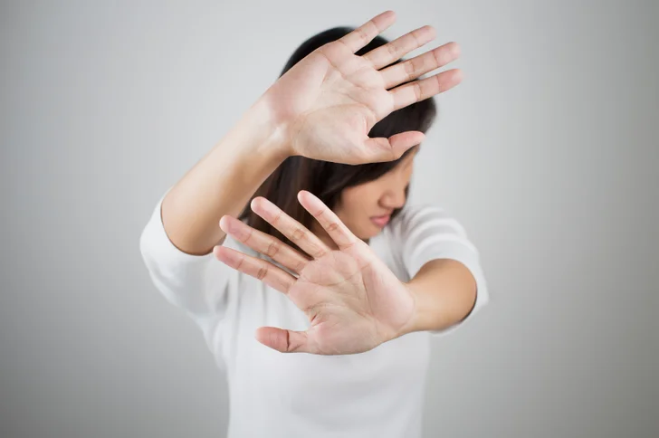 woman hands up meaning No