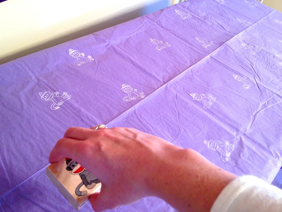 Sock monkey tablecloth from http://styledbyjess.com/2012/10/happy-first-birthday-sweet-baby-girl/