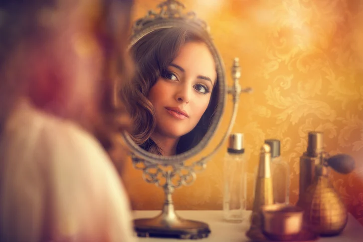 woman using mirror