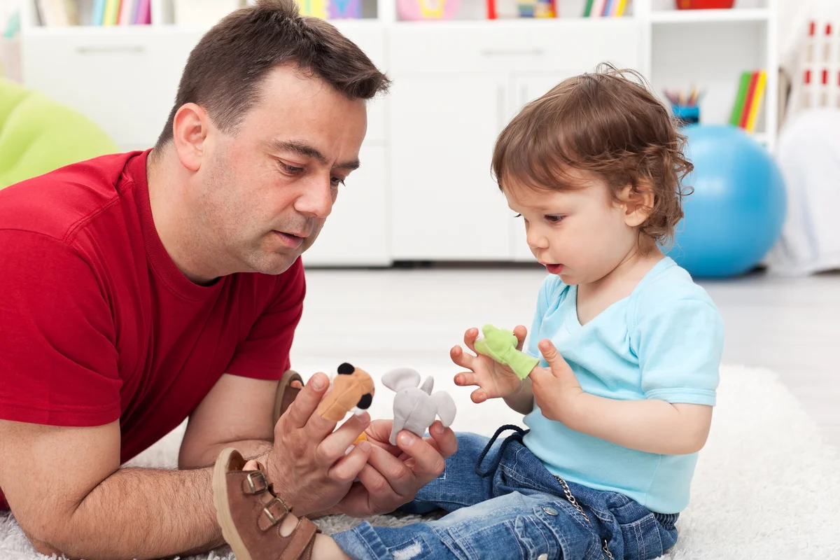 Father and toddler playing