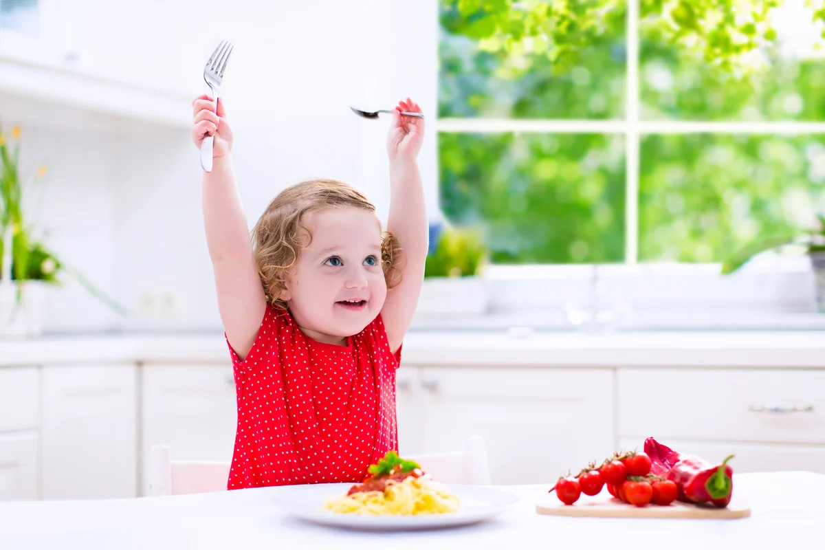 Child eating pasta