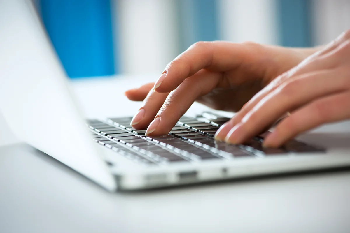 typing on laptop