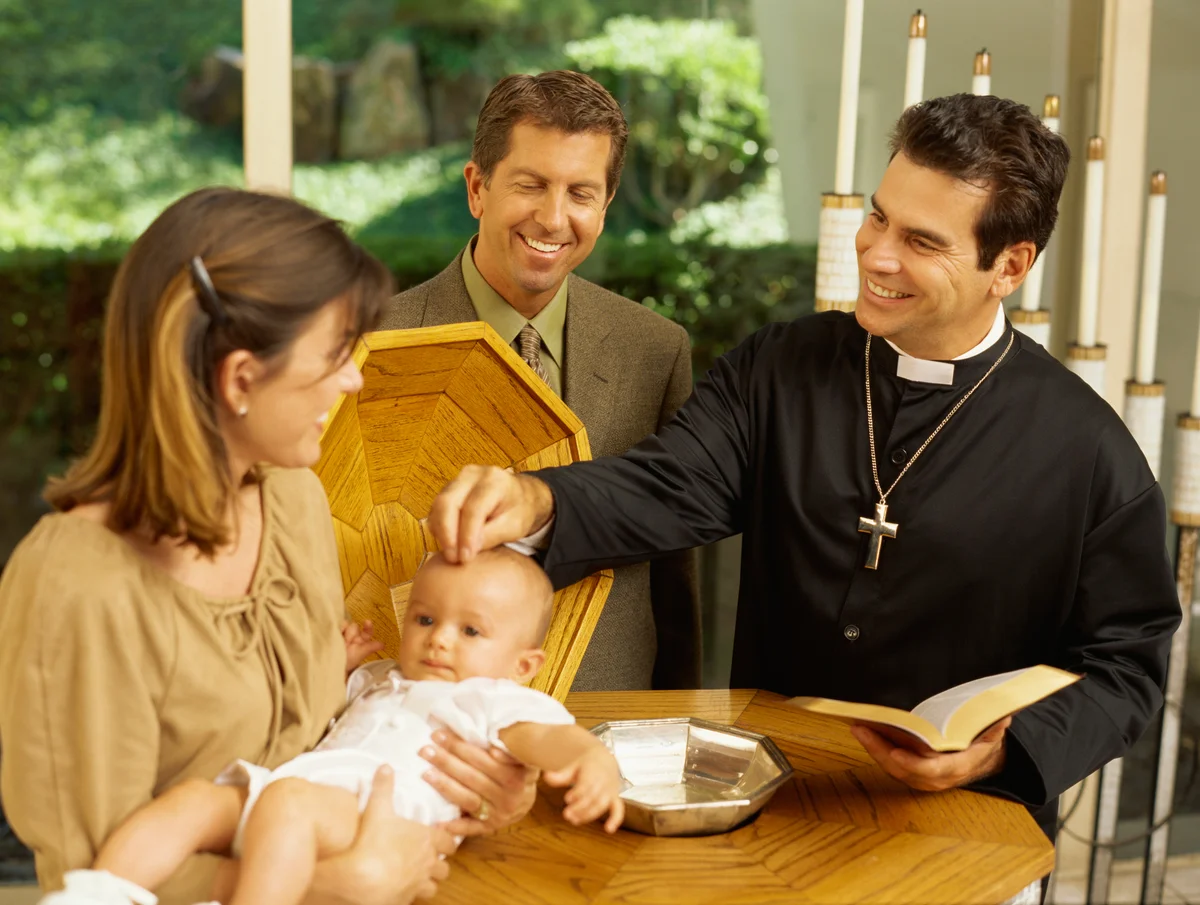Priest and baby boy