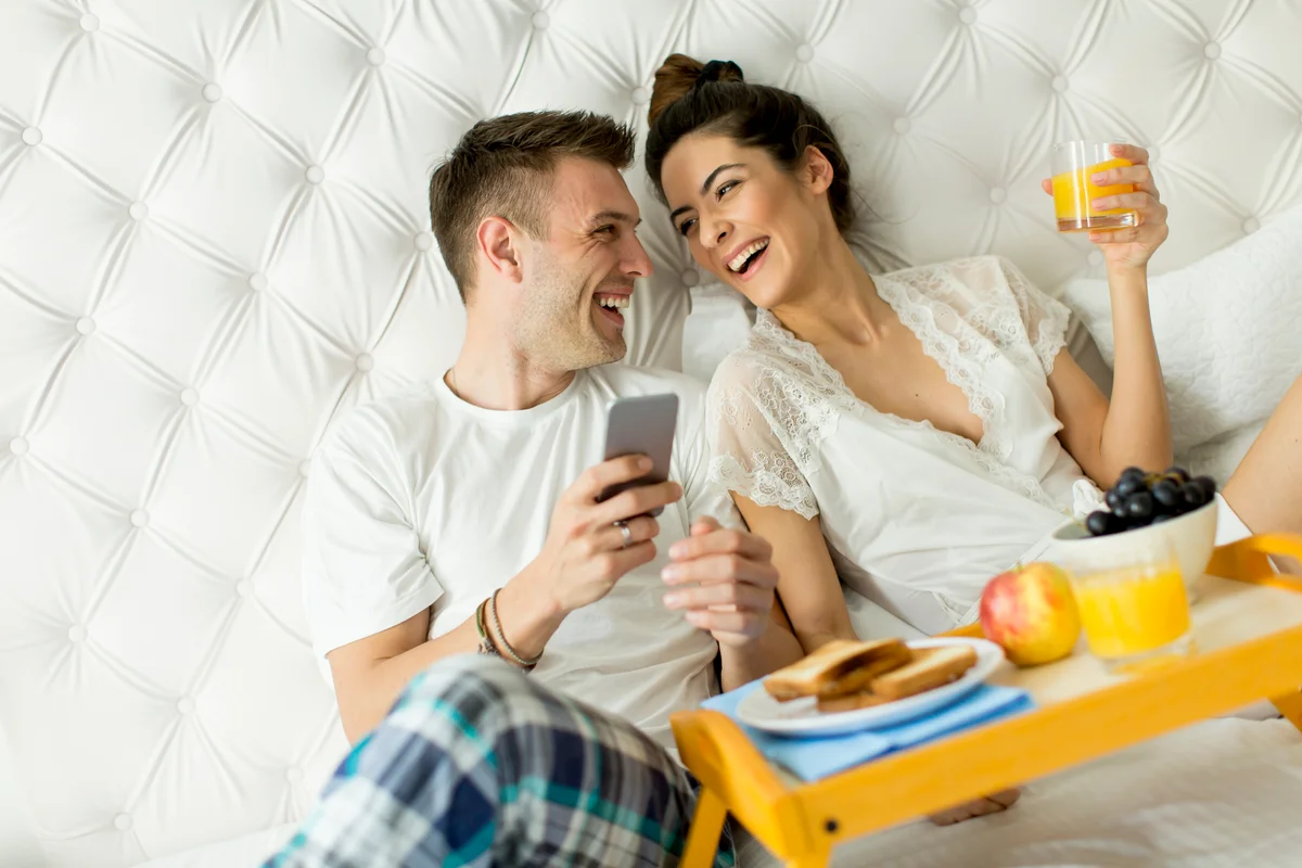 Couple having a breakfast in bed
