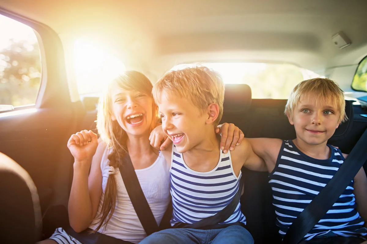 Kids having fun in car on road trip