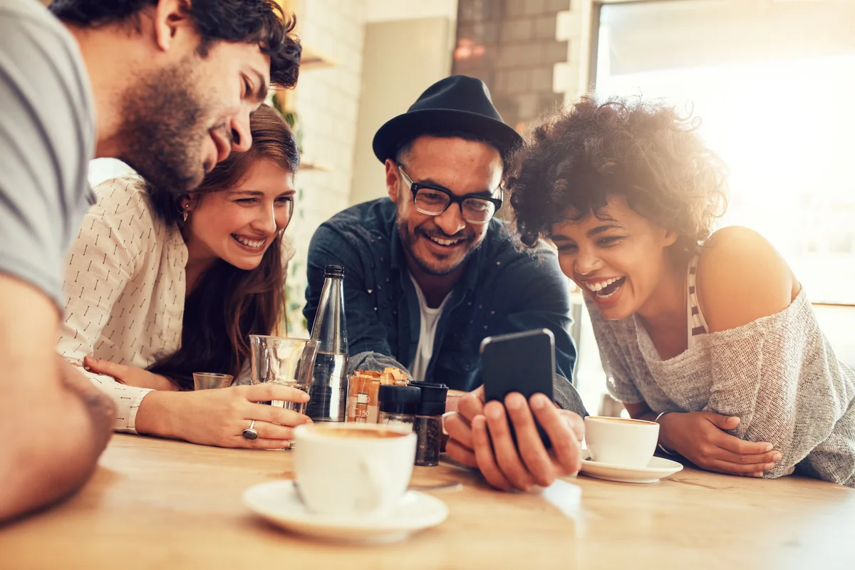 Friends looking at smart phone
