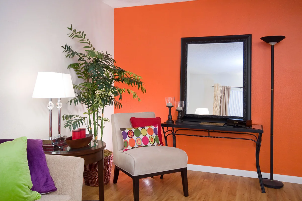 Flame Orange Living Room with purple and green jewel accent colors