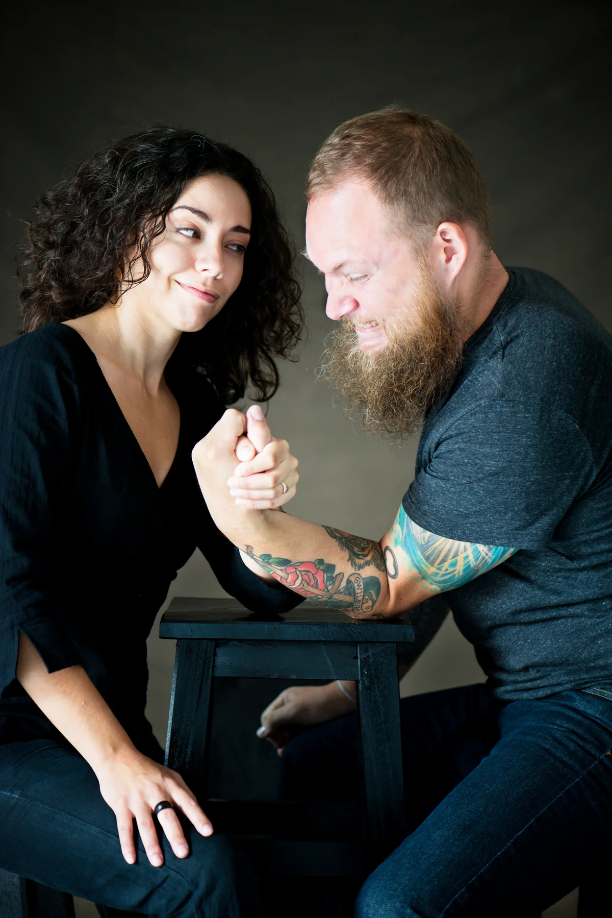 loving couple arm wrestling