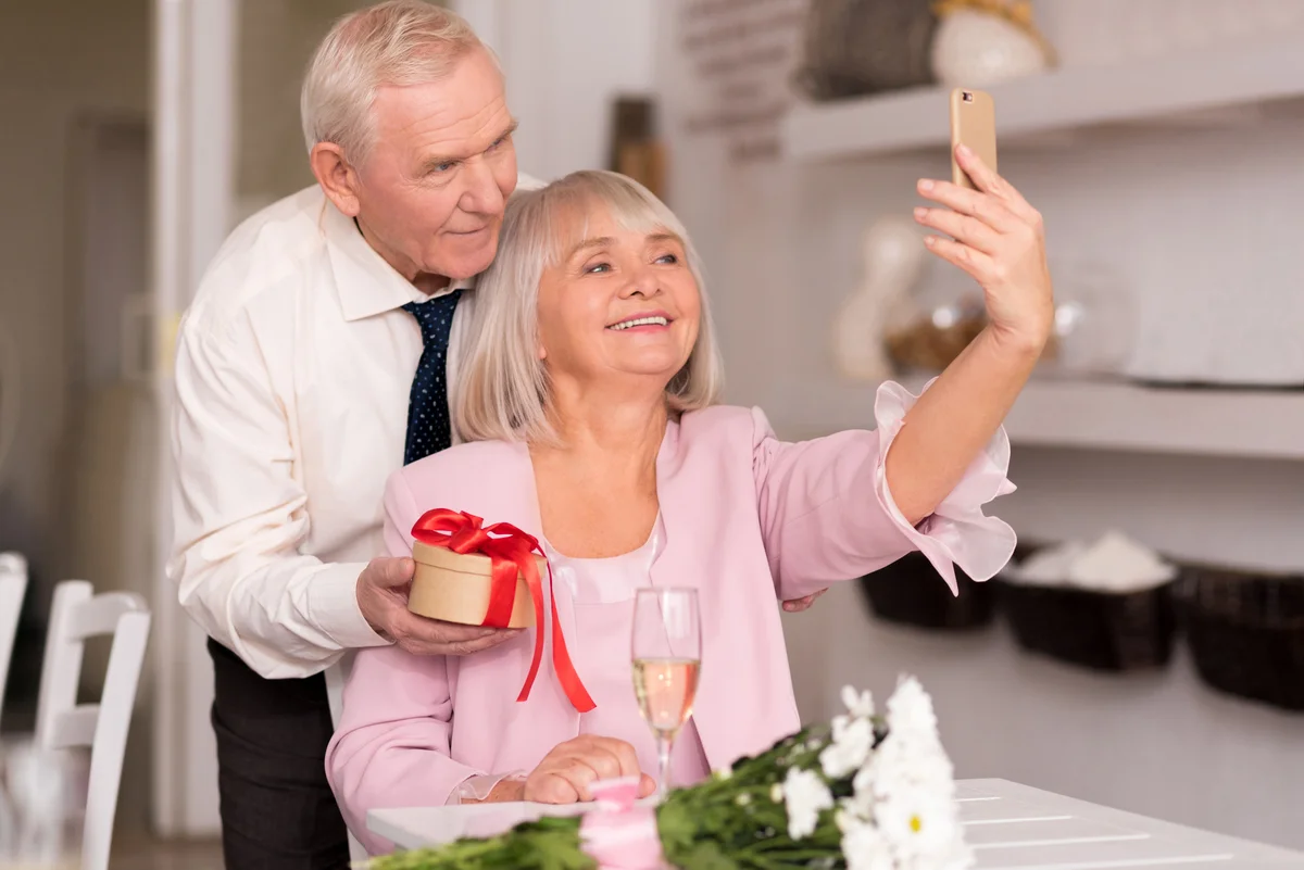 mature couple taking selfie