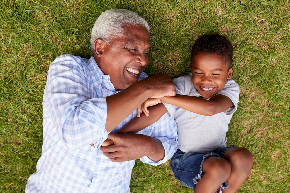 Grandfather and grandson playing