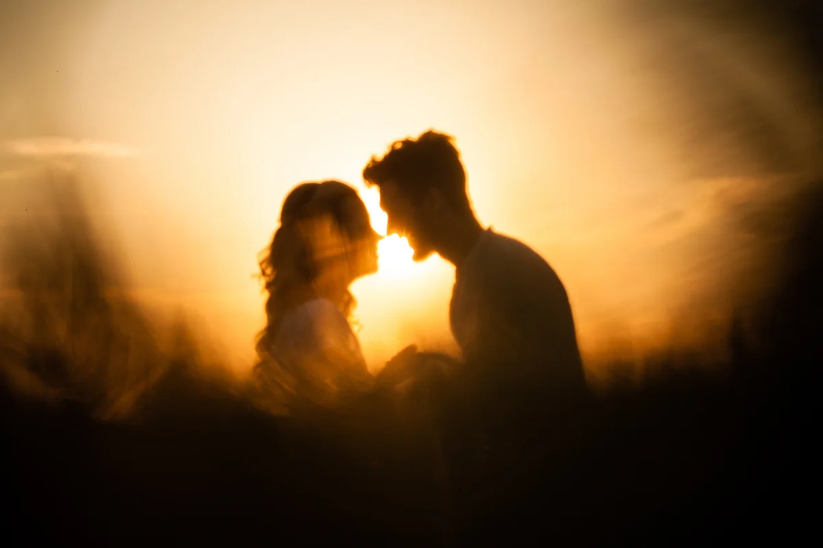 silhouetted kissing couple