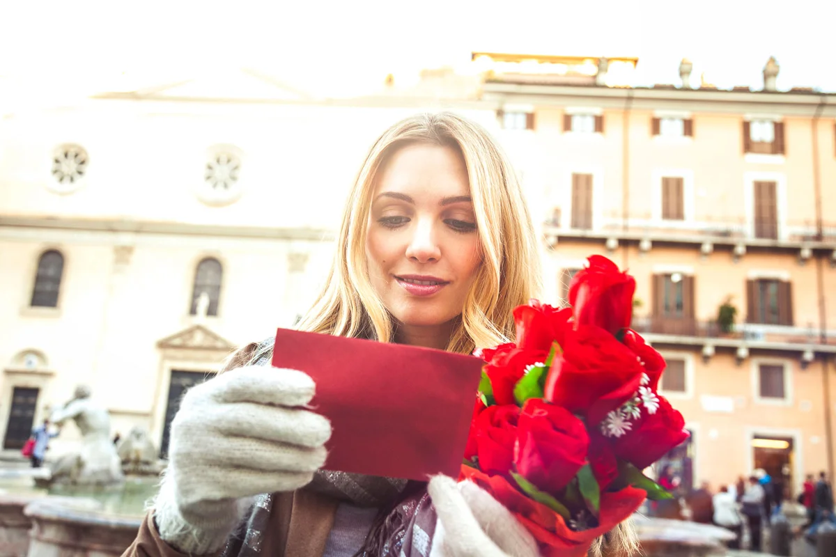 Woman receives a bouquet of roses