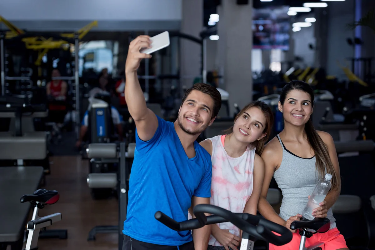 Man taking selfie with women friends