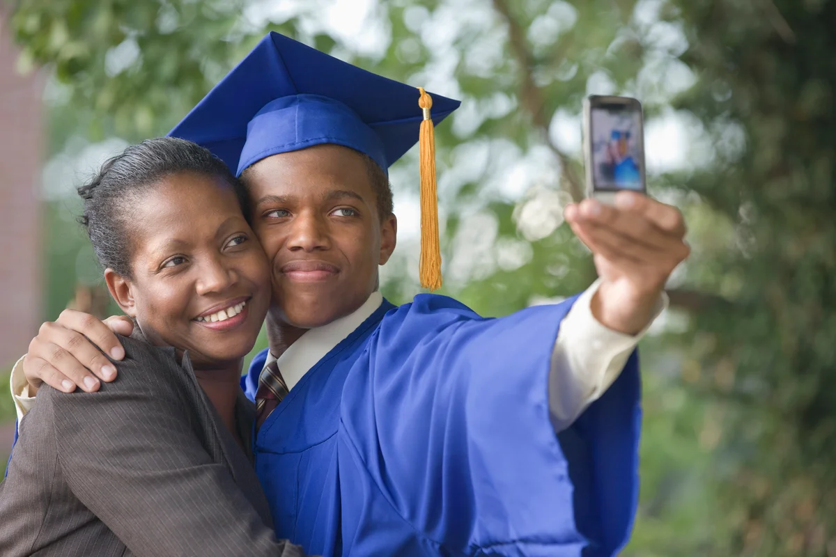 Graduating teenager with mother