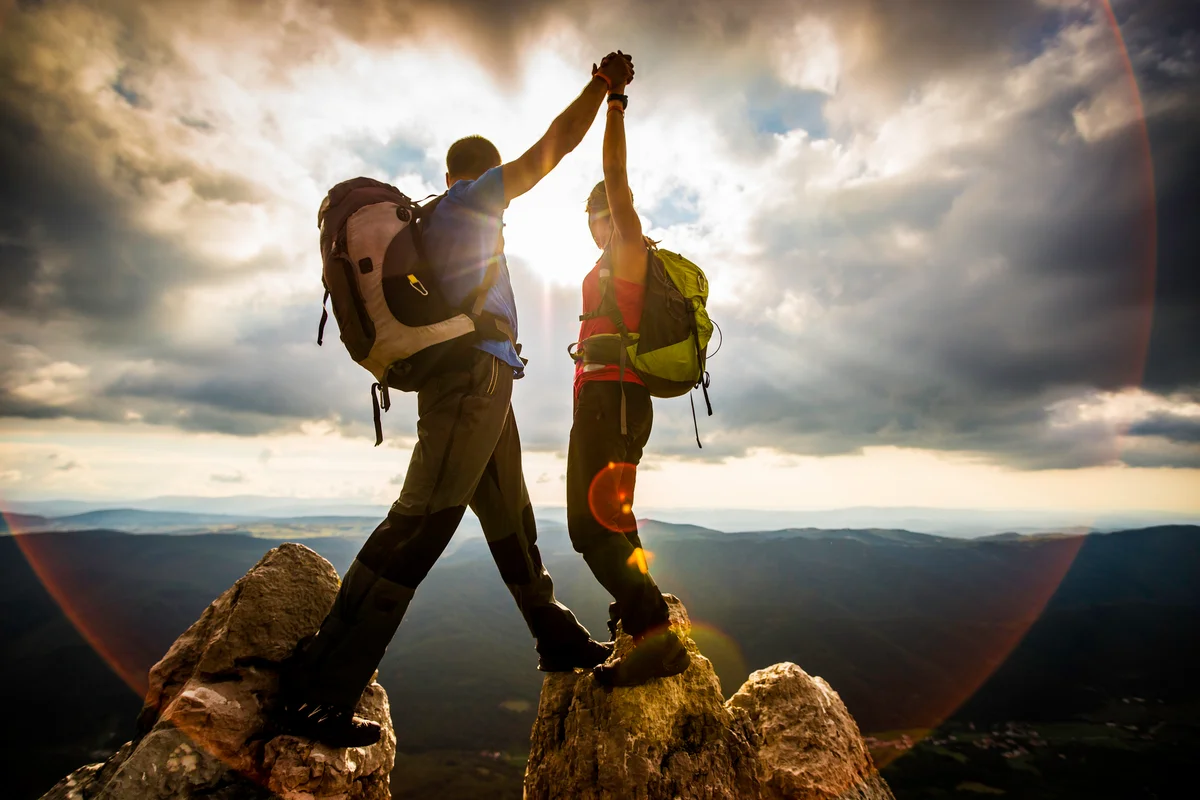 Couple on top of a mountain
