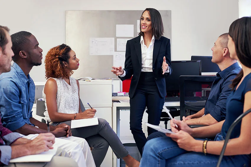 Employees at morning meeting
