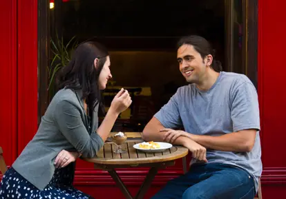 Couple at sidewalk cafe