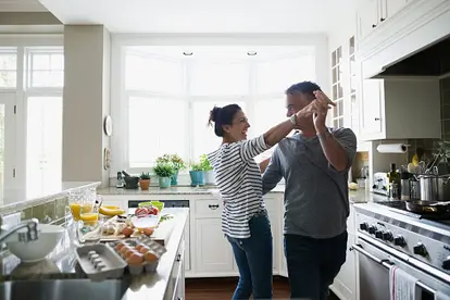 Couple dancing in kitchen
