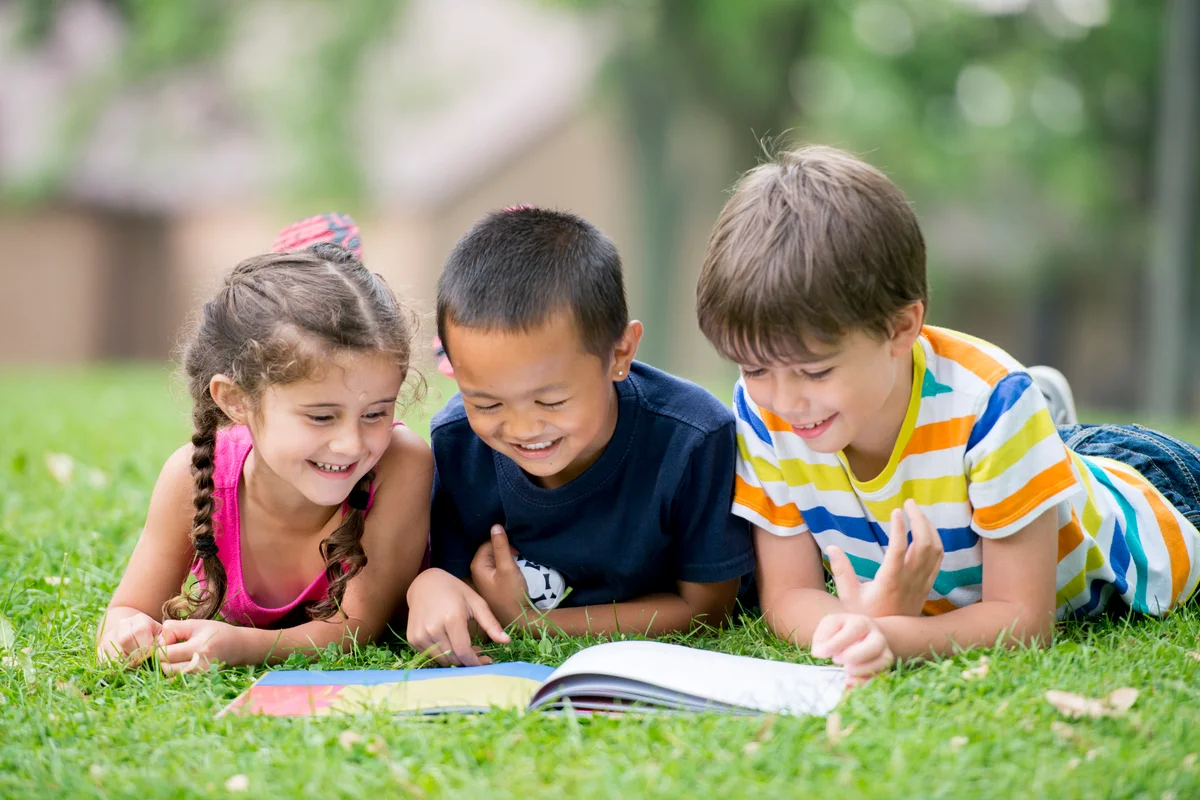 Children Reading a Book