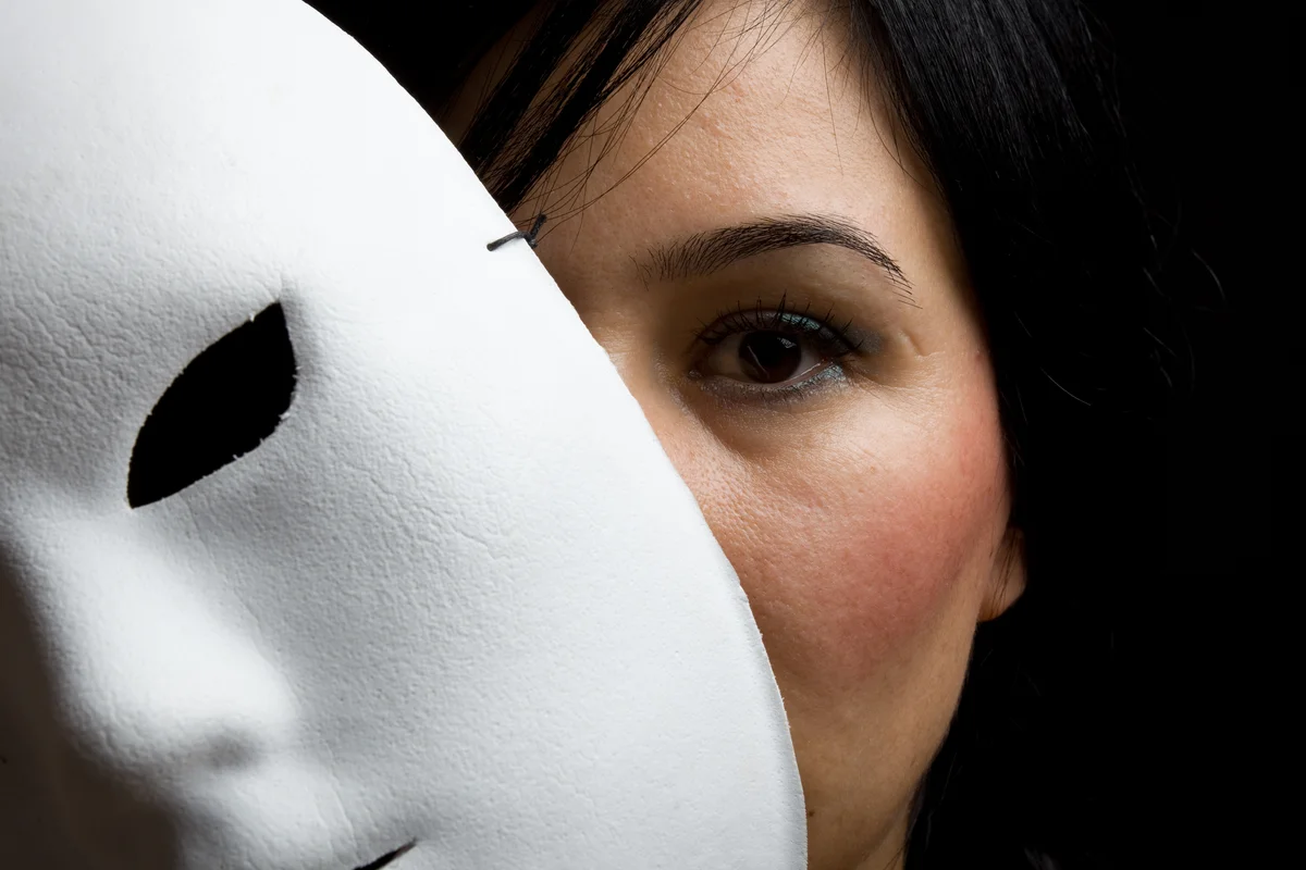 Woman Behind Mask
