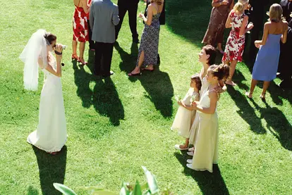 Bride filming bridesmaids