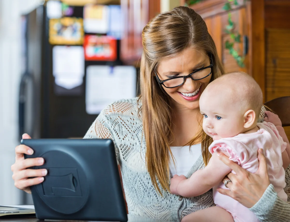 mom with baby and tablet