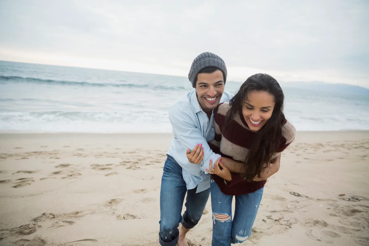 Playful couple on beach