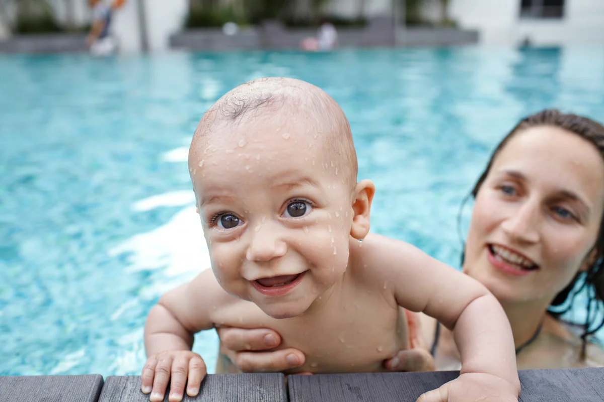 Mother and child practicing swimming